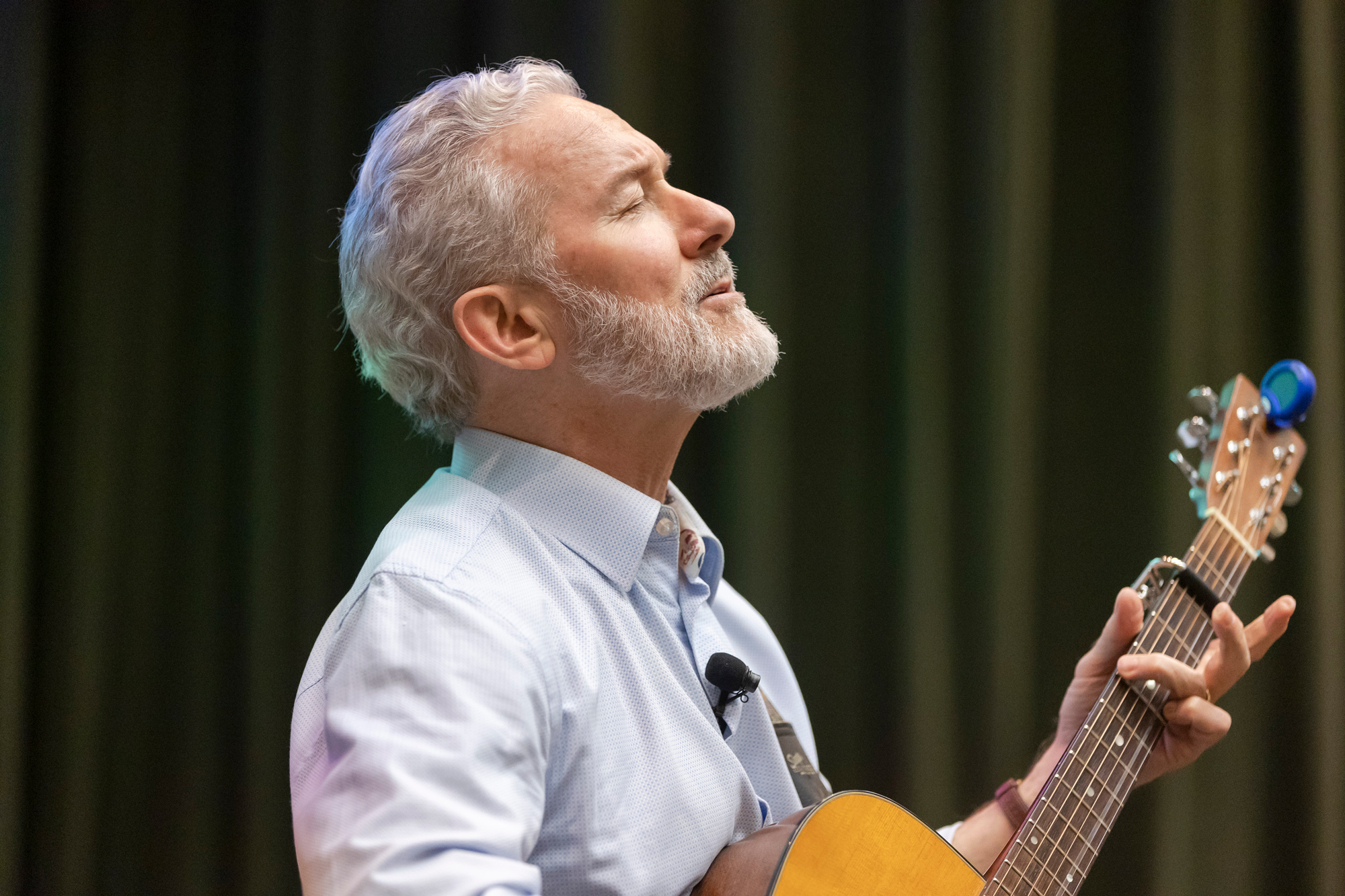 Portrait of Rich Lyons, while playing guitar