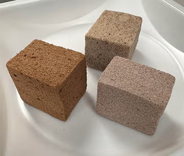 A set of three foam blocks, each a different shade of brown