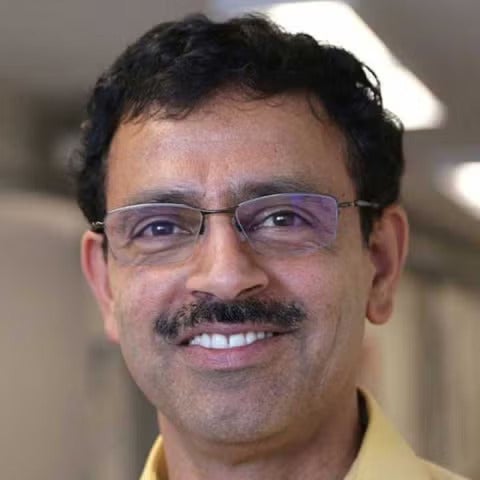 A man with glasses and a moustache