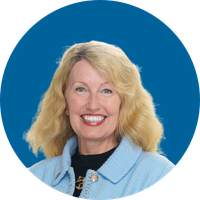 A woman with shoulder-length blonde hair smiles