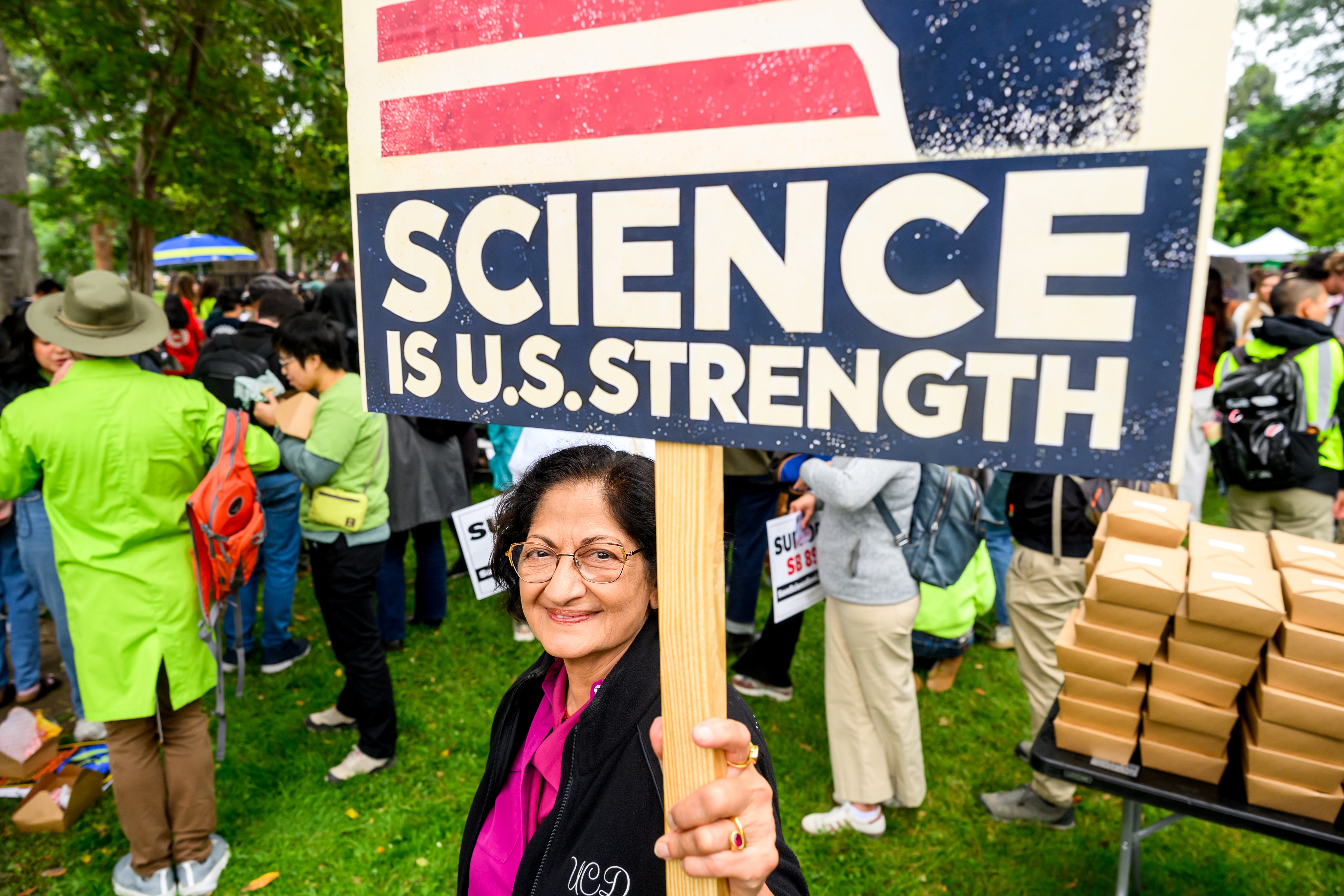 Person holds sign saying "Science is U.S. Strength."