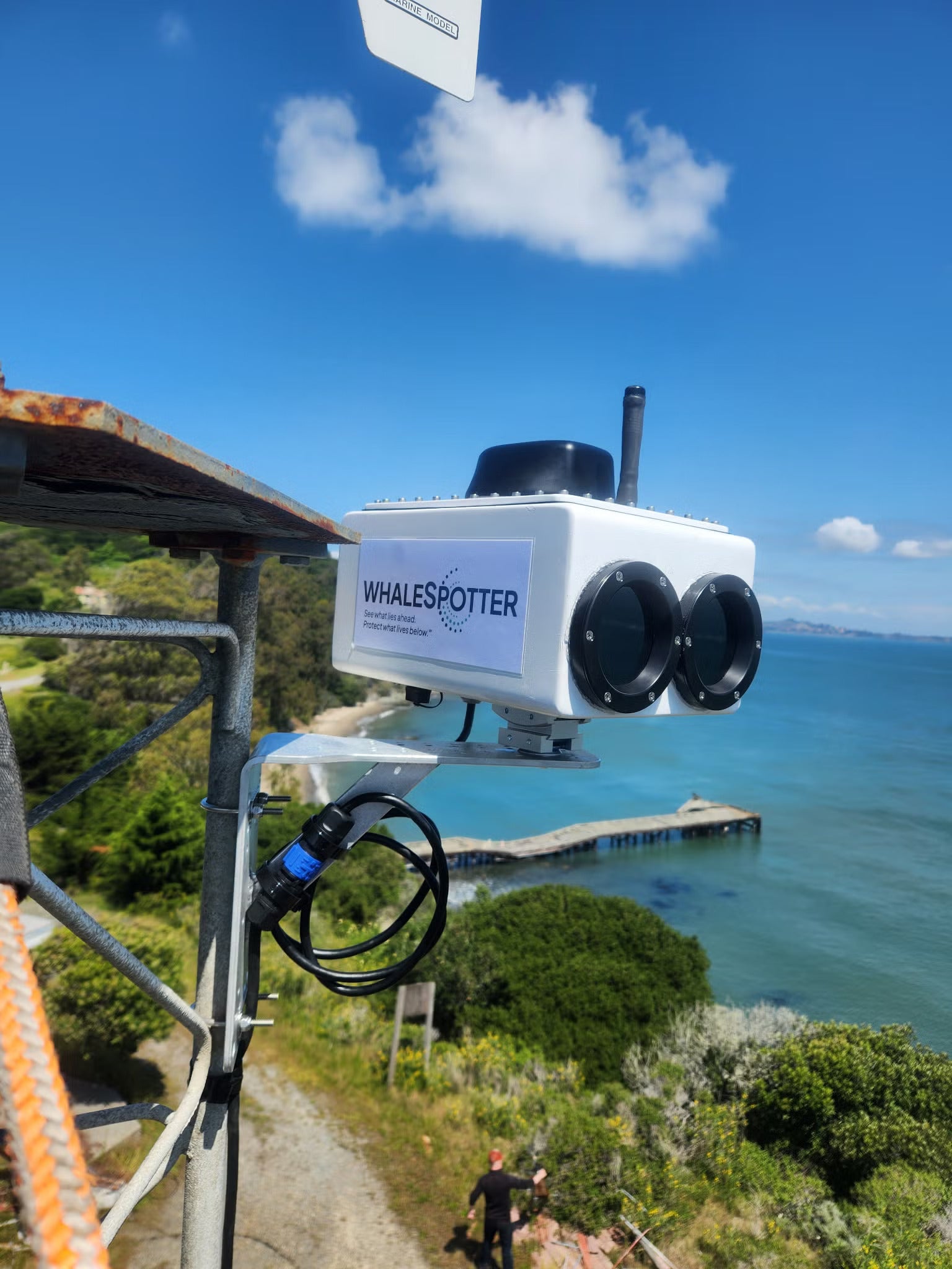 A camera mounted on a clifftop next to the ocean