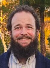 Headshot of a man with a beard