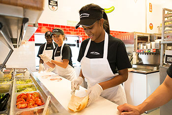 Fast food worker making a sandwich