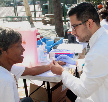 Medical student working with a resident