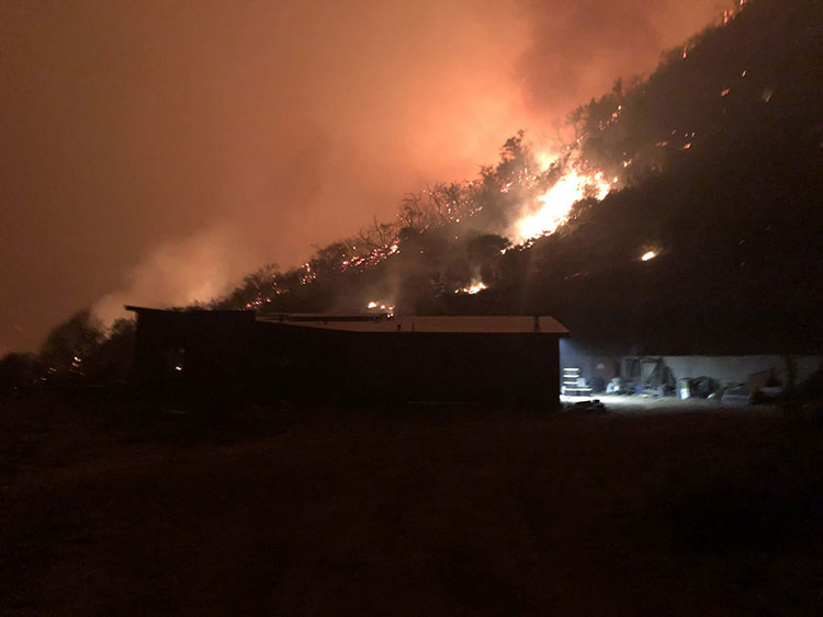 Water tanks and and fire sprinklers with big red skies in the background