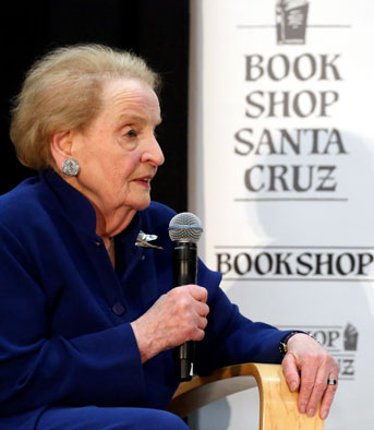 Madeleine Albright holds a microphone