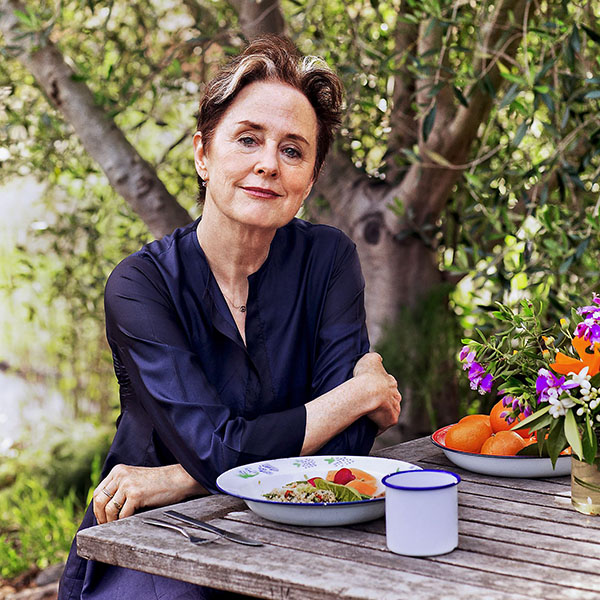 Alice Waters at a table