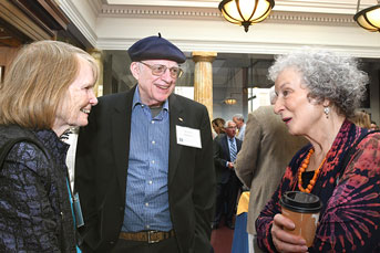 Margaret Atwood smiles for a selfie with two other women