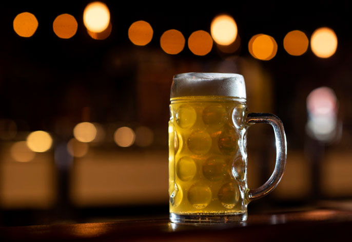 Foamy beer at a bar Foamy beer at a bar