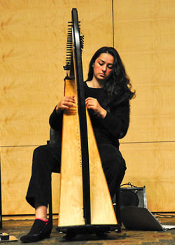 Boser playing the harp