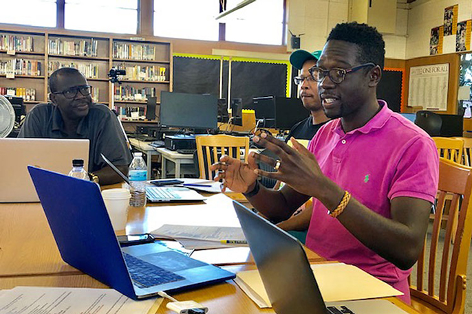 Travis Bristol, a faculty member at the UC Berkeley Graduate School of Education, meets with members of the Compton Male Teacher of Color Network in Southern California