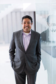 Atul Butte standing outside building