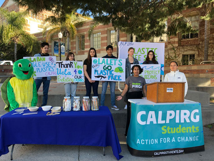 CALPIRG students together supporting their cause with a turtle mascot