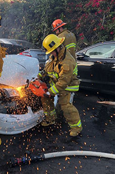 Woman fighting a car fire
