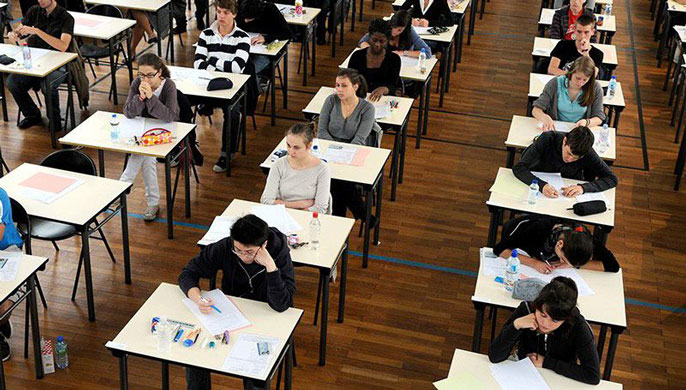 Children in class sitting at their desks