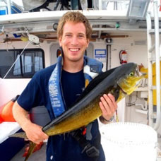 Christopher Free holding a mahi-mahi