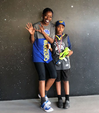 AnDrea Crawford and her son in Warriors gear