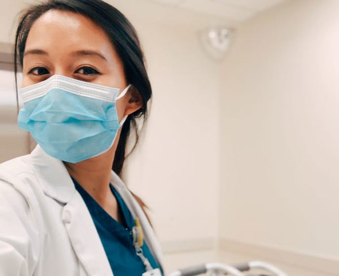 Veronica Velasquez takes a selfie in her medical gear