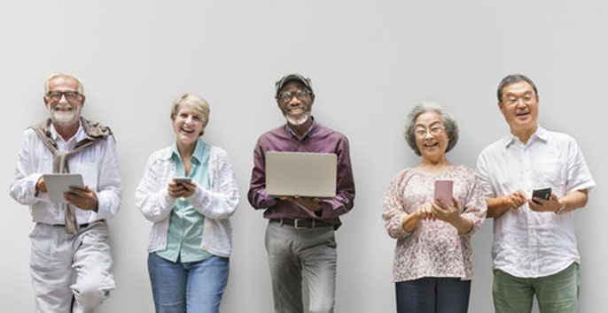 Older people holding devices standing