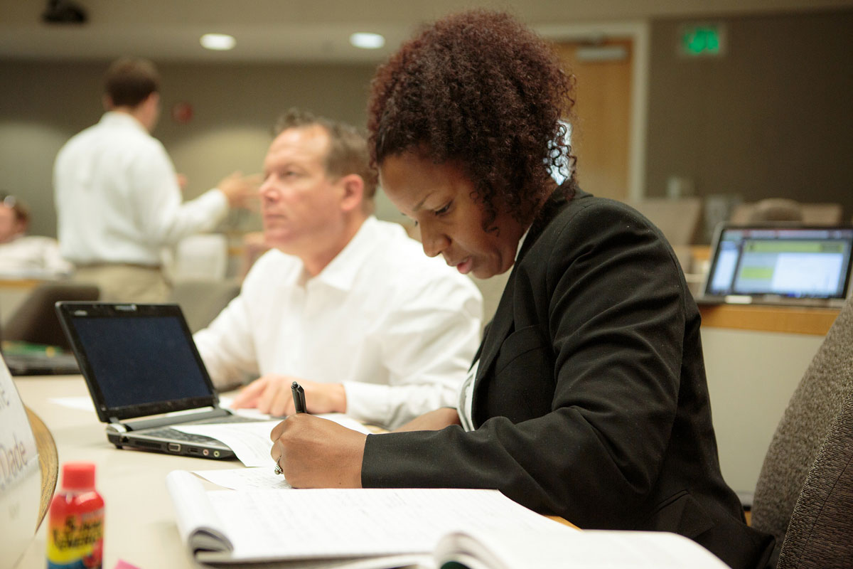 Entrepreneur bootcamp, woman writes on a piece of paper