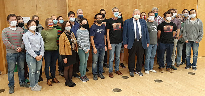 Reinhard Genzel with his team in Germany, all wearing masks