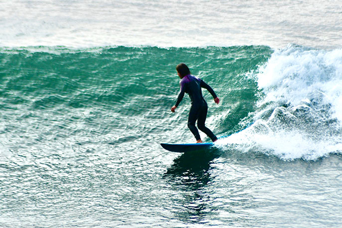 Katia Gibson surfing a wave