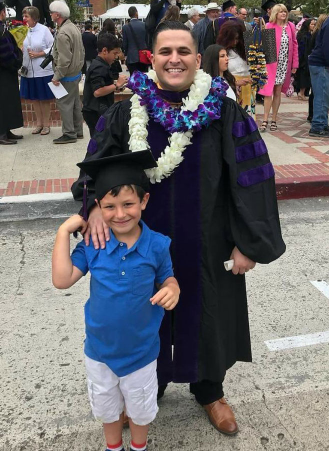 Goncalves with his son at graduation