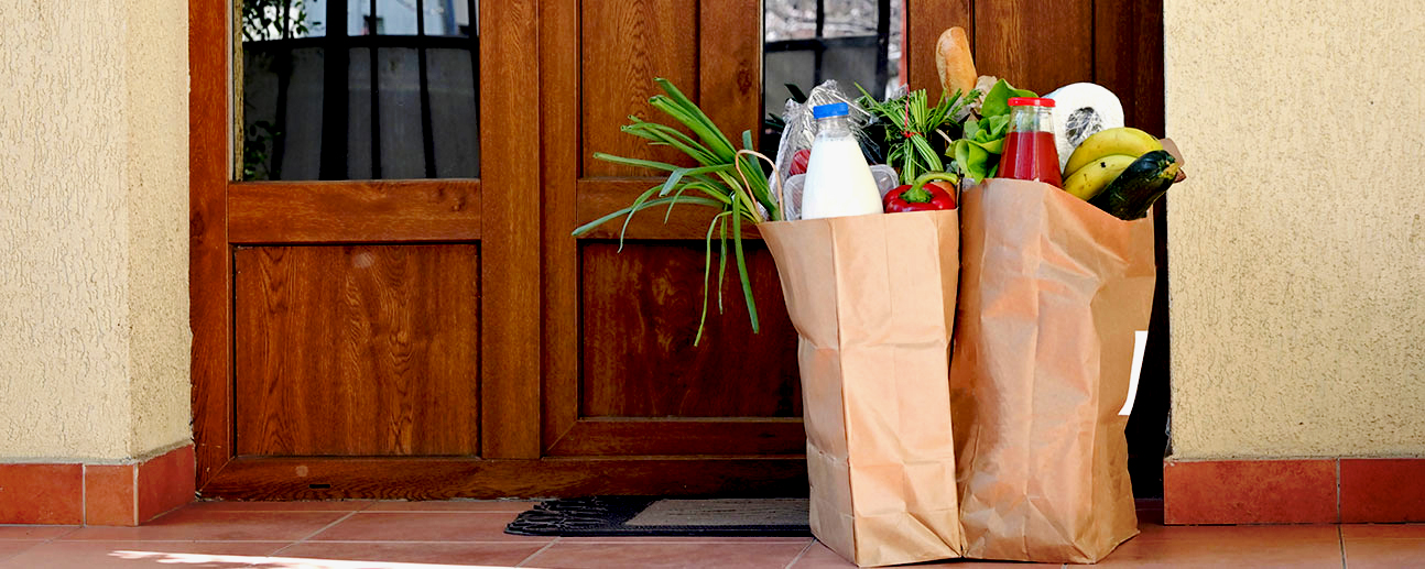 groceries sitting outside a house