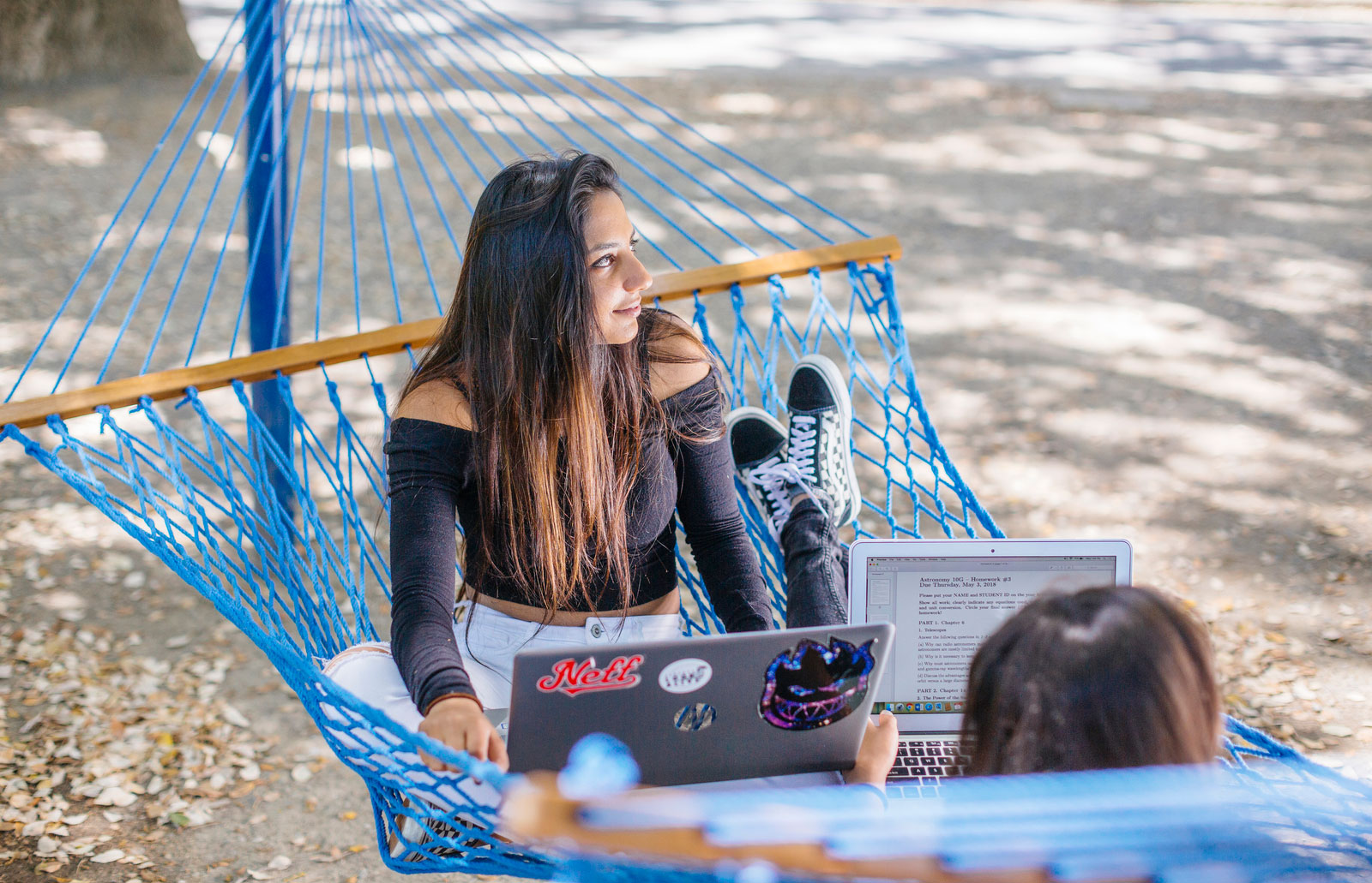 Studying together in a hammock