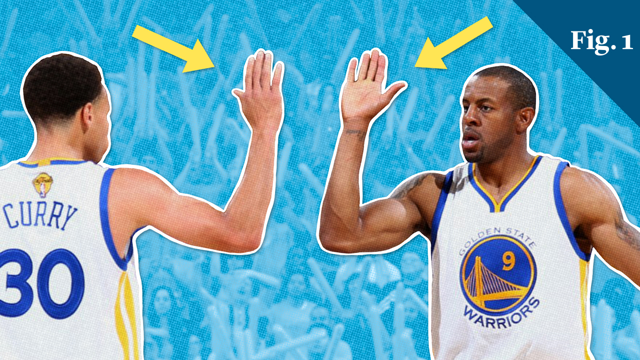 Two basketball players do a high-five