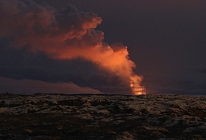 Volcano erupting at night in Iceland