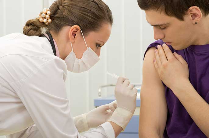 patient gets immunization shot