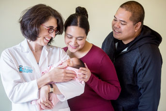 Tippi MacKenzie holds baby with parents