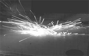 sparks from titanium golf club