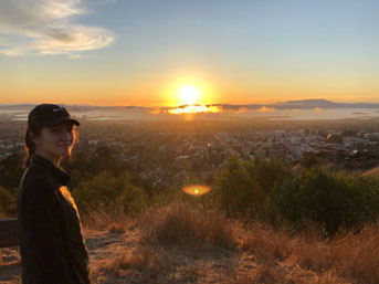 Leyla Kabuli hiking the Panoramic Trail at sunset