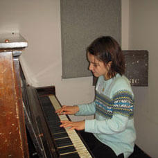 Leyla Kabuli playing piano as a child
