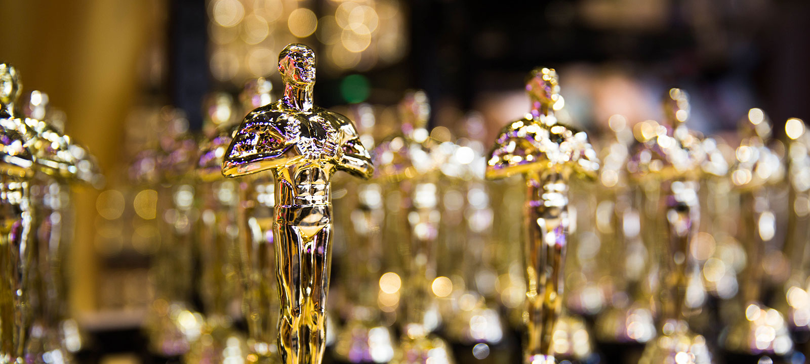 Oscar statuettes in a row