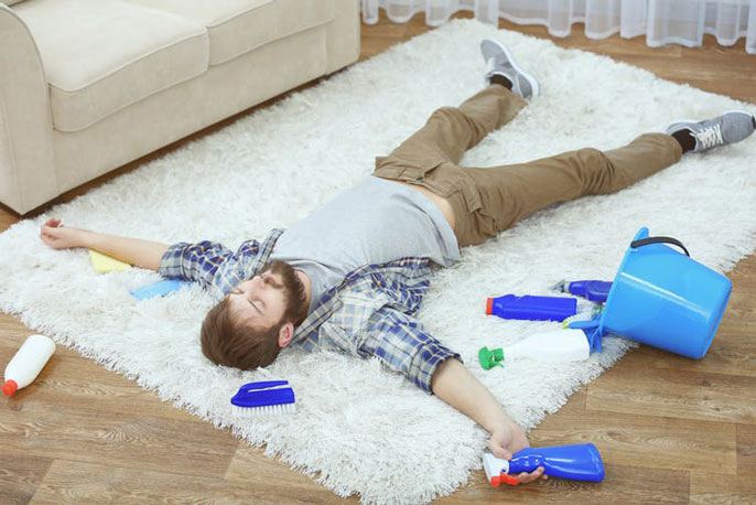 Man lying on rug relaxing