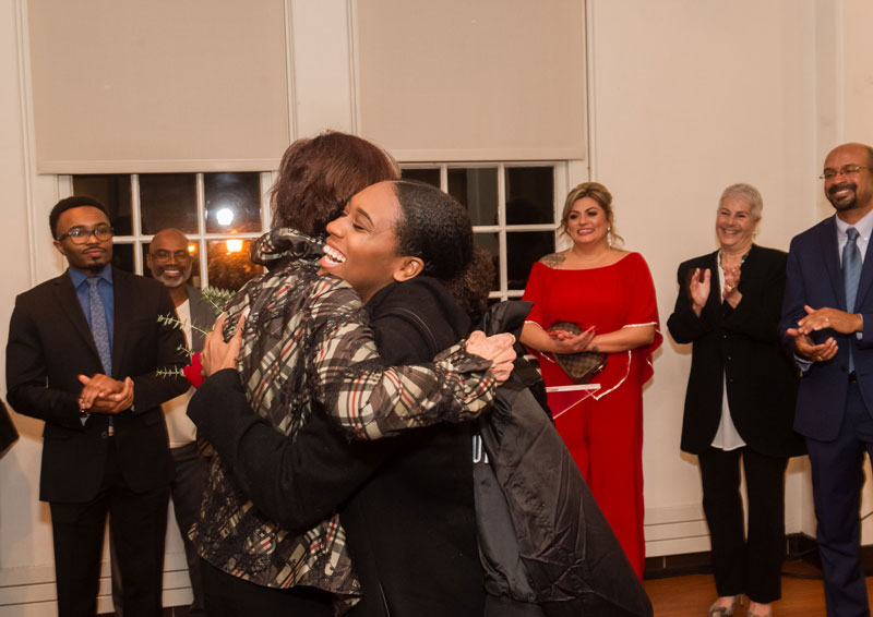 Mariah Watson hugs Sen. Nancy Skinner