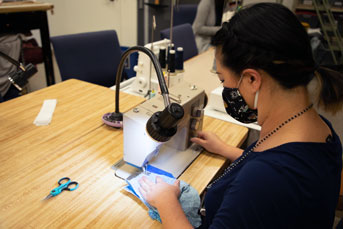 sewing masks on a table