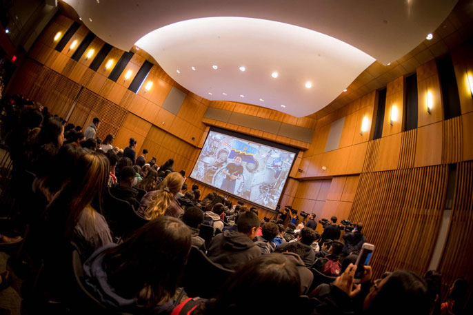 Jessica Meir takes questions in the auditorium