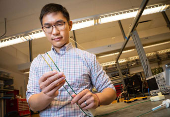 Michael Yip holding the robotic catheter