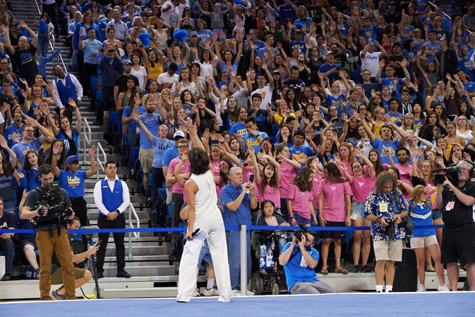 Miss Val cheers with the crowd