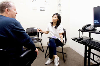 doctor talks with a patient