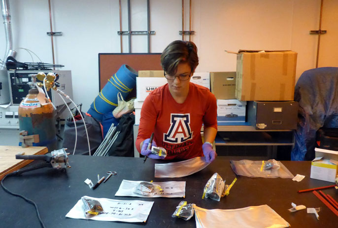 Nancy Freitas at a work table