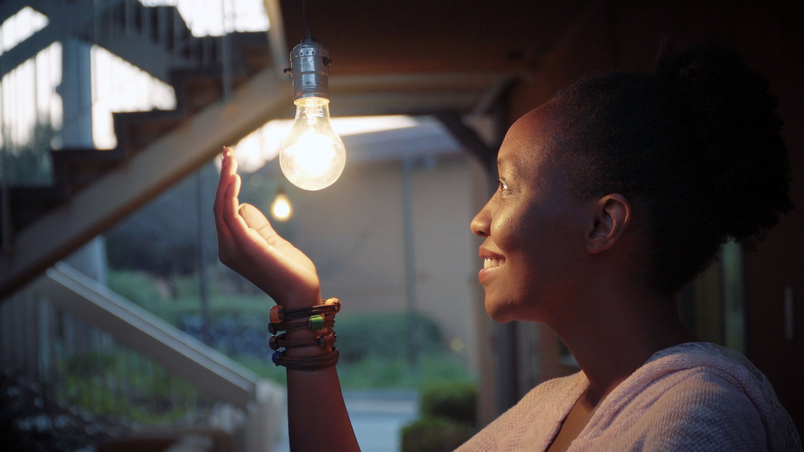 Lydia Natoolo with lightbulb