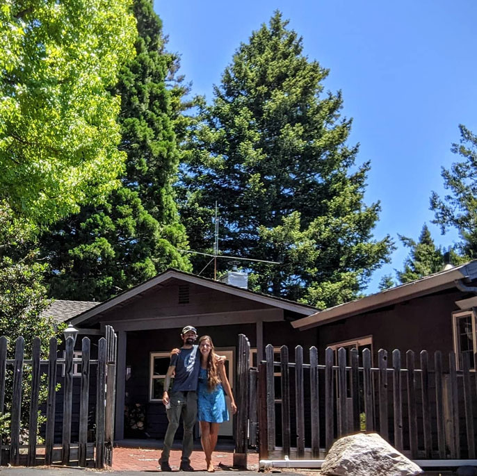 Patrick Robinson and Roxanne Beltran in front of their home before it was lost to the fire