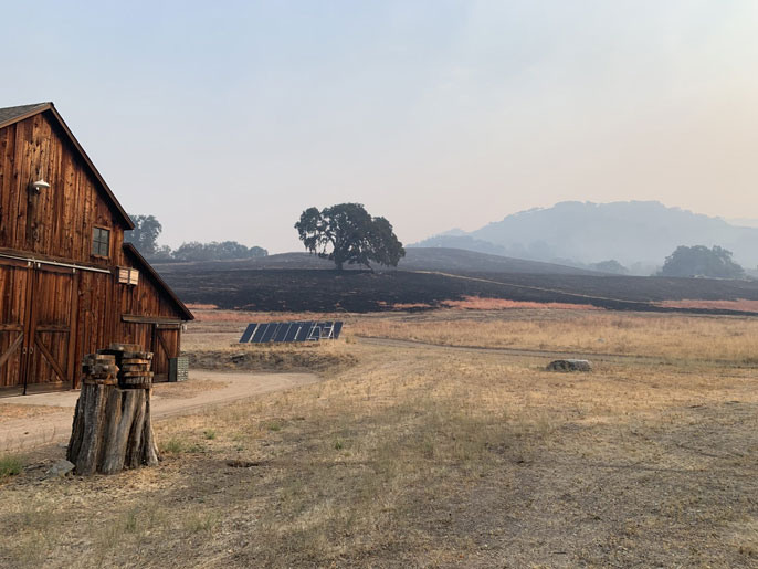 Burned out hills near a barn