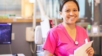 Smiling nurse in a room